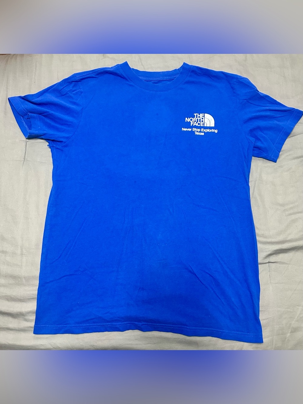 The North Face Short-Sleeve Tee in Bright Blue with White Logo and Red TX Size L